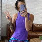 model taking a selfie in the purple peekaboo back tank top