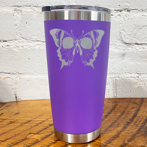 20oz purple tumbler with silver skull butterfly in the center 