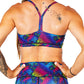 back view of rainbow colored turtle patterned sports bra