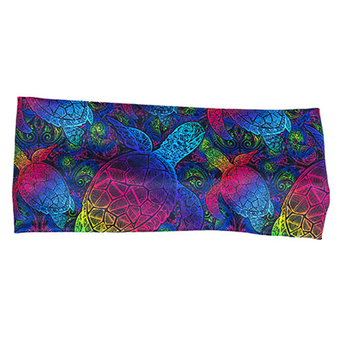 front view of headband with pink, yellow, blue, green and purple ombre turtle print on it