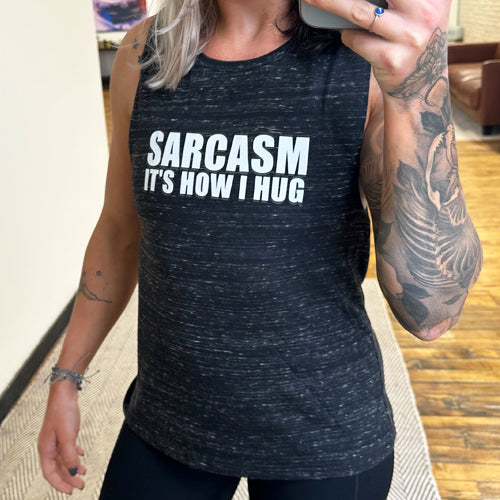 Black muscle tank with the saying "sarcasm it's how I hug" on it
