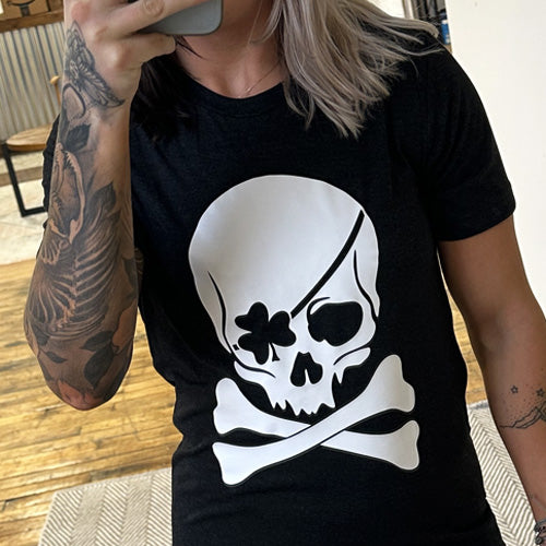 black unisex shirt with a shamrock skull graphic on it in white