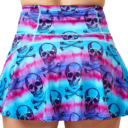 close up back view of 3.75 inch blue, pink and purple water color and skull patterned skirt
