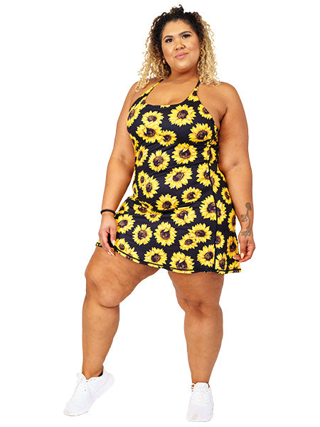 model wearing sunflower print dress