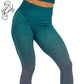 Close up photo of the teal ombre leggings. These are teal at the top and fade to grey at the bottom of the legs.