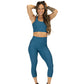model wearing solid teal textured print leggings and matching longline bra