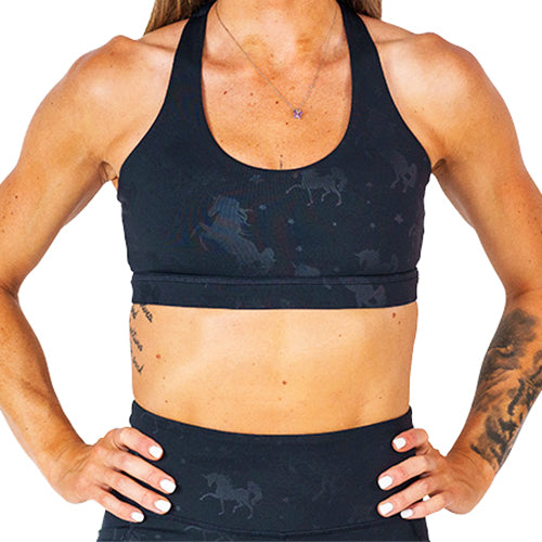 front view of black sports bra with black unicorn detailing 