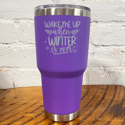 30oz purple tumbler with silver saying "wake me up when winter is over" with mini snowflakes around it