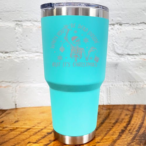 30oz teal blue tumbler with silver saying "when you're dead inside but it's christmas" with a santa hat skeleton holding ornaments