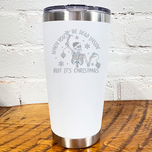 20oz white tumbler with silver saying "when you're dead inside but it's christmas" with a santa hat skeleton holding ornaments