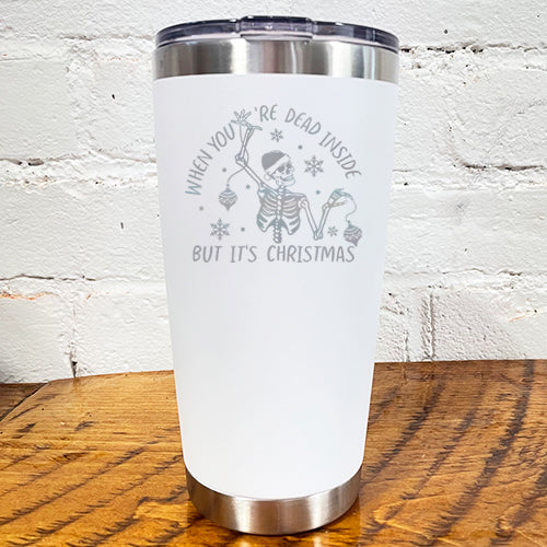 20oz white tumbler with silver saying "when you're dead inside but it's christmas" with a santa hat skeleton holding ornaments