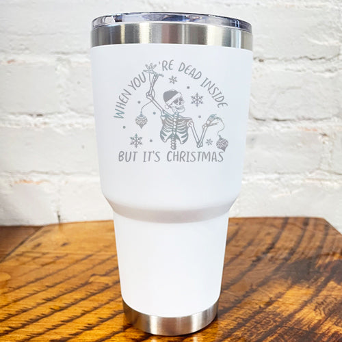30oz white tumbler with silver saying "when you're dead inside but it's christmas" with a santa hat skeleton holding ornaments