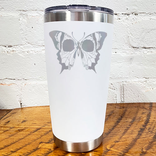 20oz white tumbler with silver skull butterfly in the center