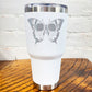 30oz white tumbler with silver skull butterfly in the center