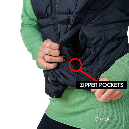 Close up photo showing the zipper pockets on the black vest.