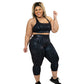 model wearing black zebra print capri length leggings and matching sports bra